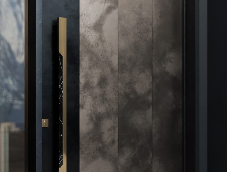 Entryway featuring the sleek and sophisticated Zeno Door Pull, combining polished brass with Nero Marquina marble