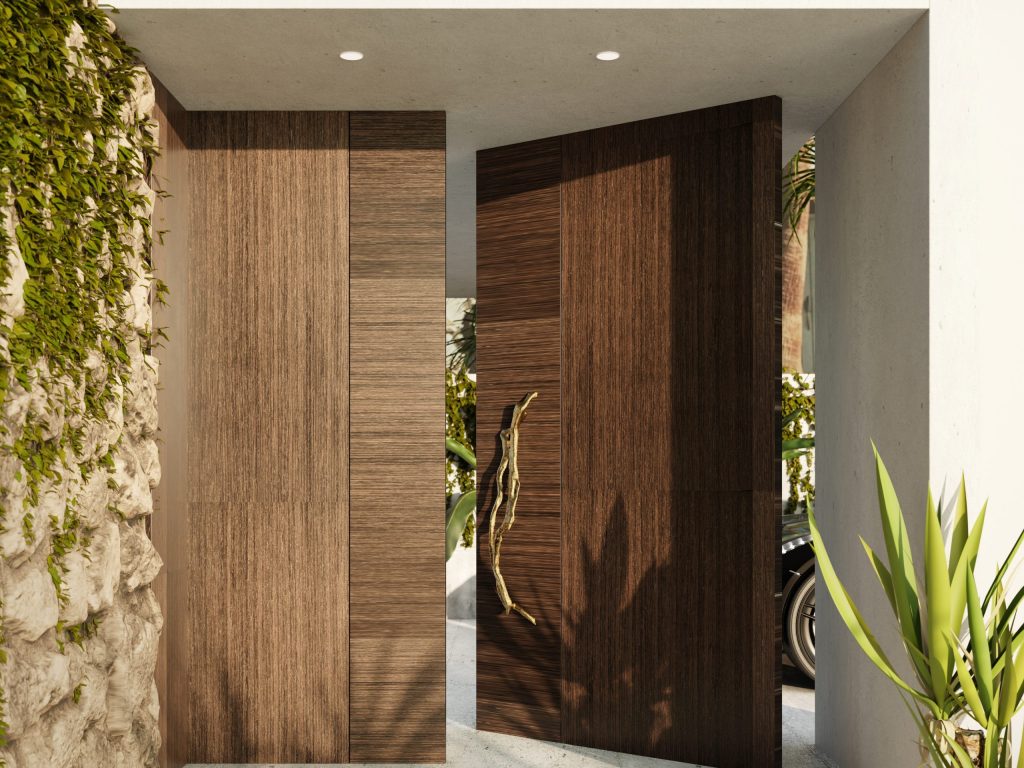 Flow Big Sized Door Pull by PullCast featured on an Entryway. A strong wood door combines to perfection with the polished brass door hardwarebold design